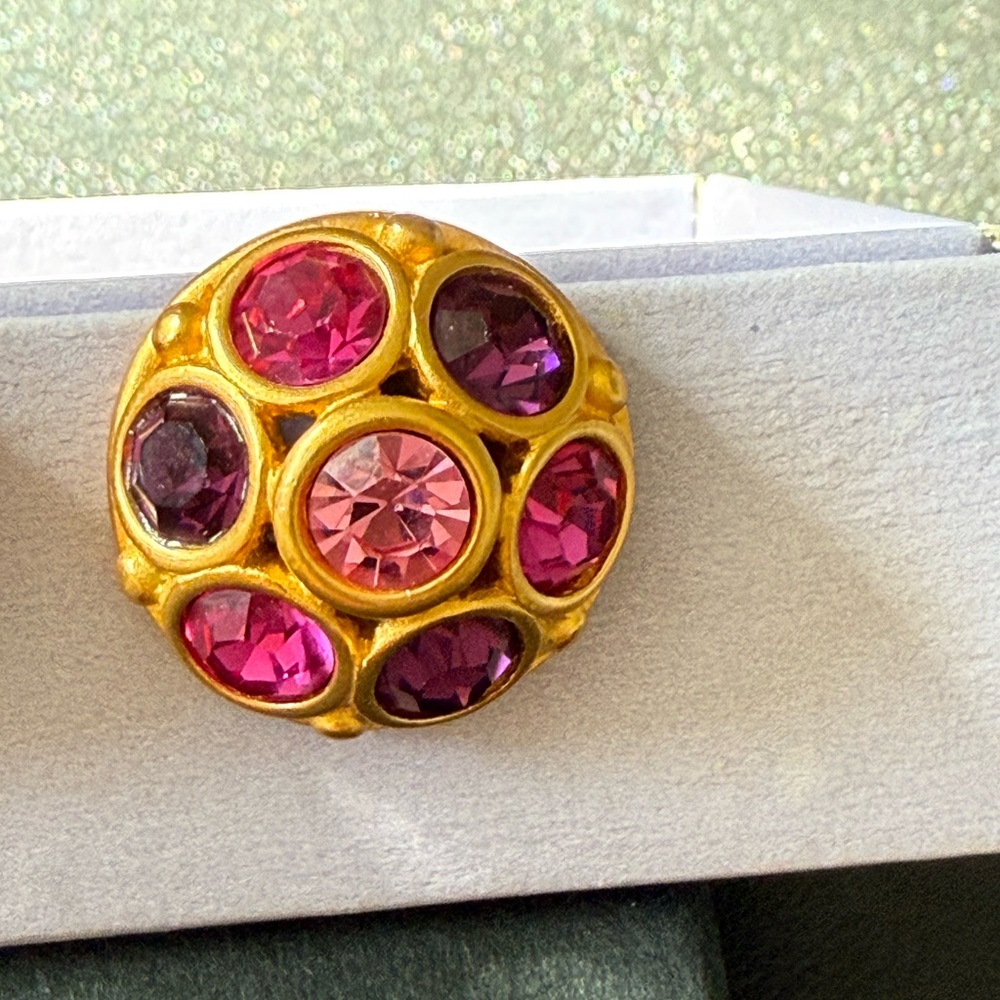 Pink and Purple Rhinestones set in yellow tone gold dome. Clip-ons.
